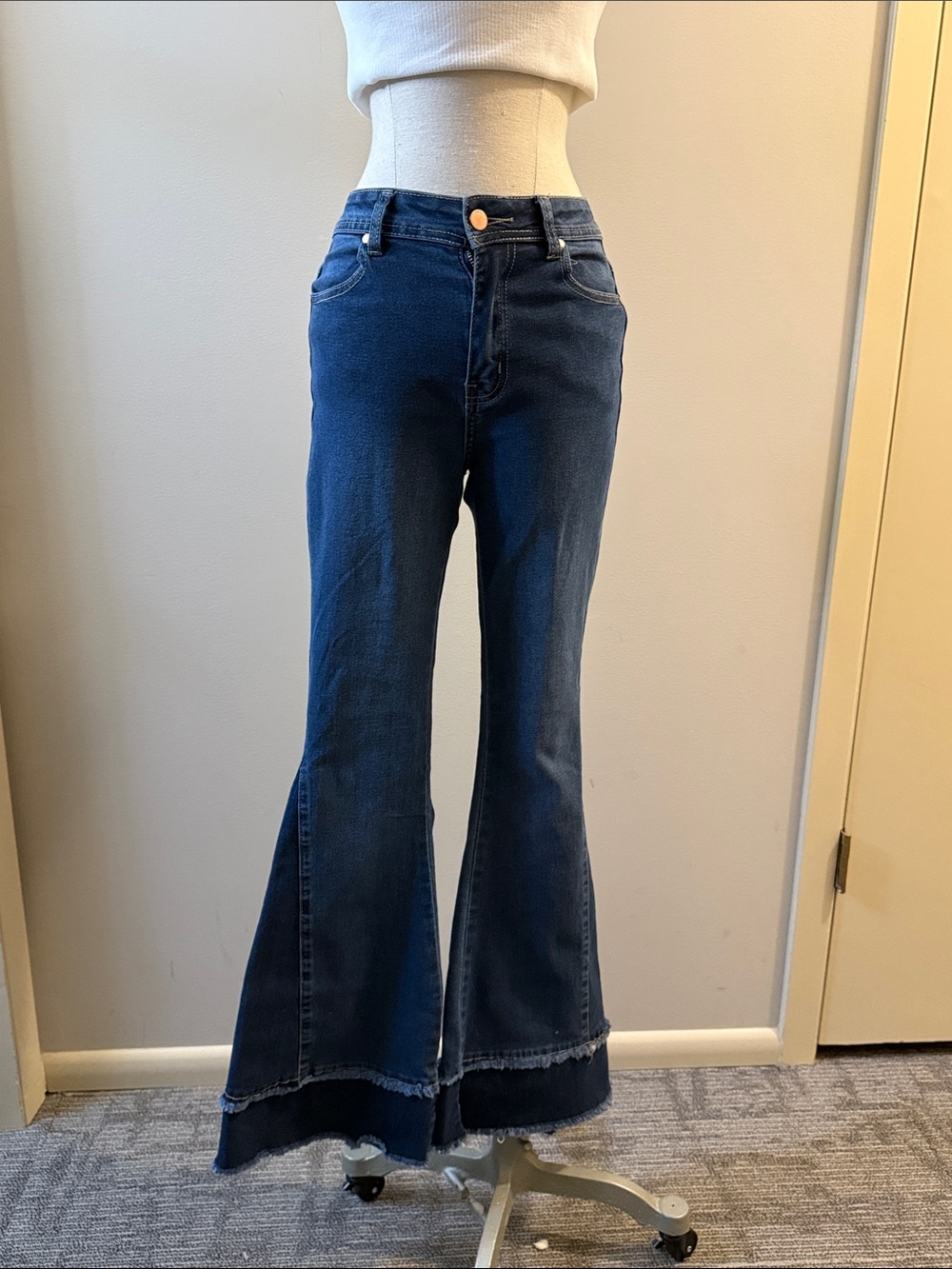 High-Rise Dark Blue Flare Jeans with Layered Raw Hem